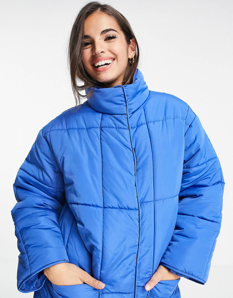 quilted longline puffer coat in cobalt