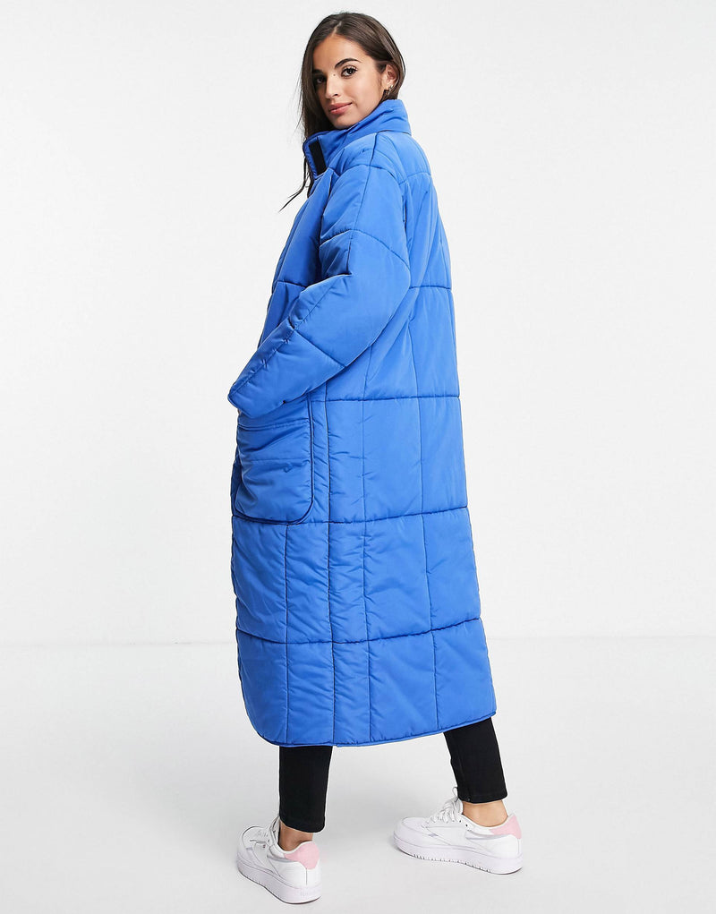 quilted longline puffer coat in cobalt